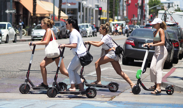 People Driving Scooters