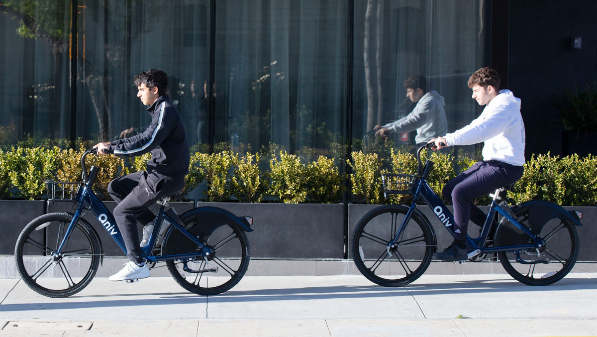 people riding e-bikes